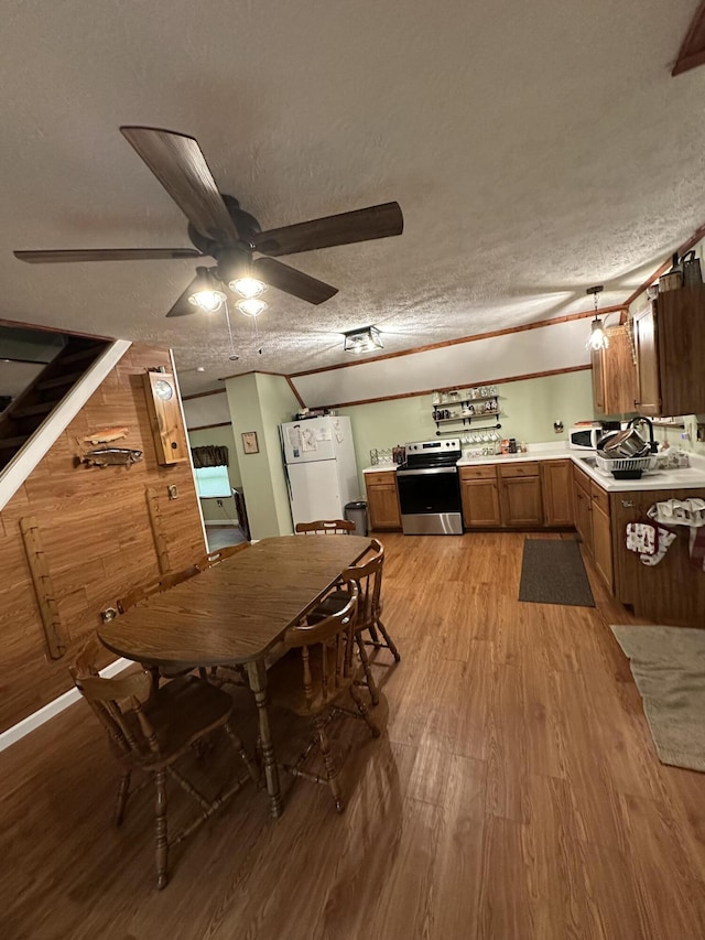 100 Buck Dr, Wellington, KY 40387 - dining area with light wood-type flooring, a ceiling fan, and a textured ceiling