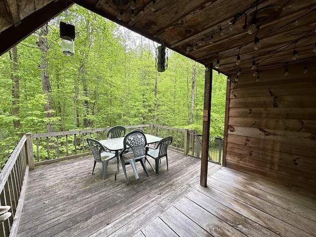 100 Buck Dr, Wellington, KY 40387 - deck featuring outdoor dining area and a wooded view