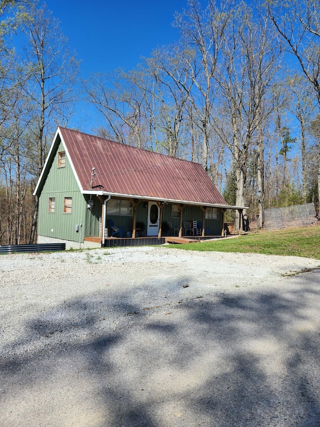42 Alley Rd, Wellington, KY 40387 - view of side of property with board and batten siding, metal roof, and covered porch
