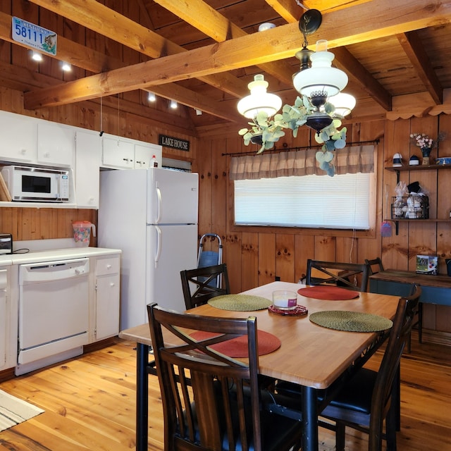 42 Alley Rd, Wellington, KY 40387 - dining room with wood walls, light wood-type flooring, beam ceiling, wood ceiling, and a chandelier