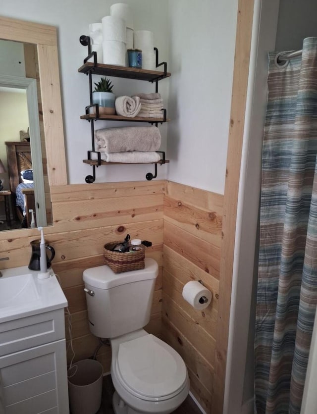 75 Hillsboro Rd, Danville, KY 40422 - bathroom featuring toilet, vanity, wooden walls, wainscoting, and a shower with shower curtain