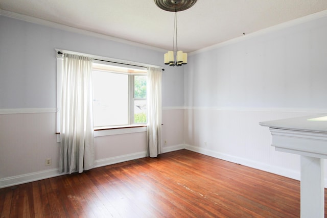 50 Sterling Ave, Fort Thomas, KY 41075 - empty room featuring crown molding, hardwood / wood-style flooring, a chandelier, a wainscoted wall, and baseboards