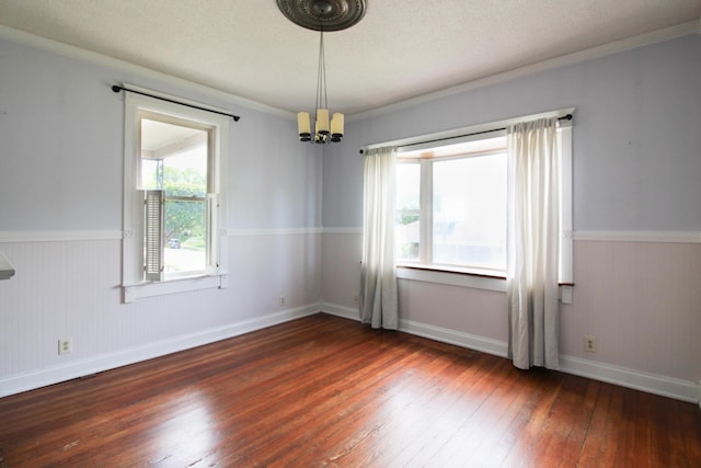 50 Sterling Ave, Fort Thomas, KY 41075 - empty room featuring a chandelier, hardwood / wood-style flooring, a wainscoted wall, ornamental molding, and baseboards