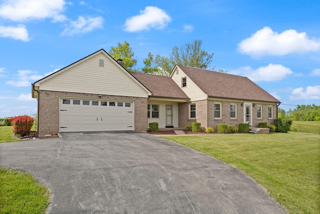 view of front of home featuring asphalt driveway, brick siding, an attached garage, and a front yard