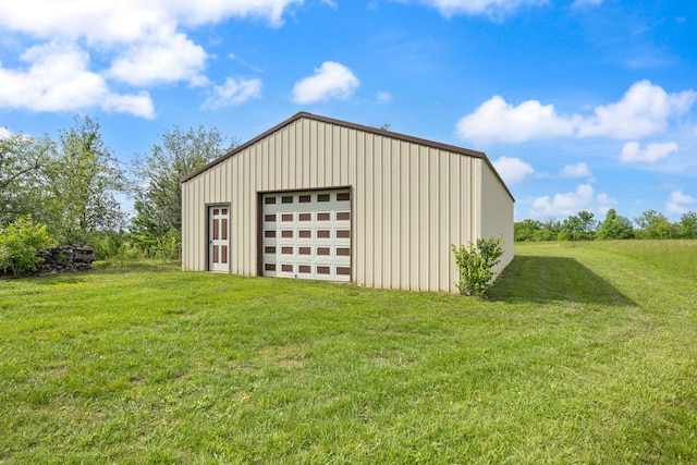 view of pole building with a yard