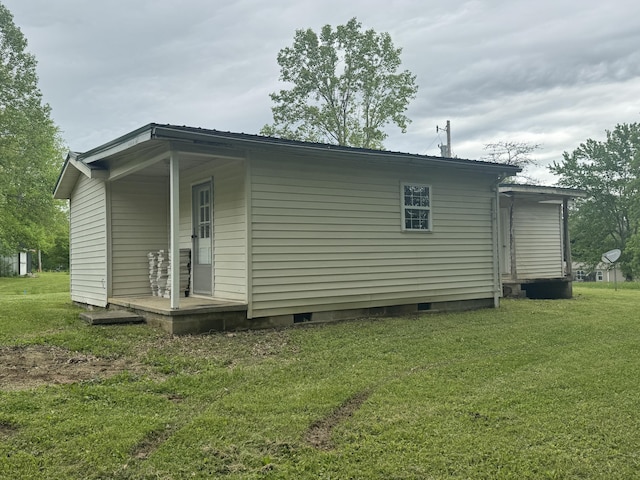 357 Powell Rd, Clay City, KY 40312 - rear view of house featuring crawl space and a lawn