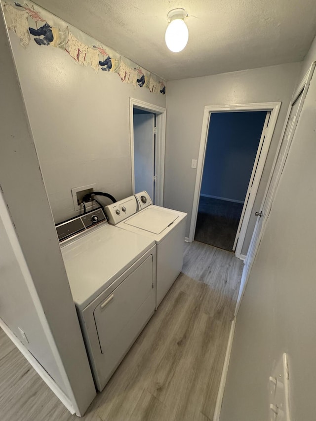 357 Powell Rd, Clay City, KY 40312 - washroom with independent washer and dryer, light wood finished floors, and a textured ceiling