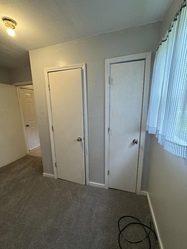 357 Powell Rd, Clay City, KY 40312 - unfurnished bedroom with carpet flooring and a textured ceiling