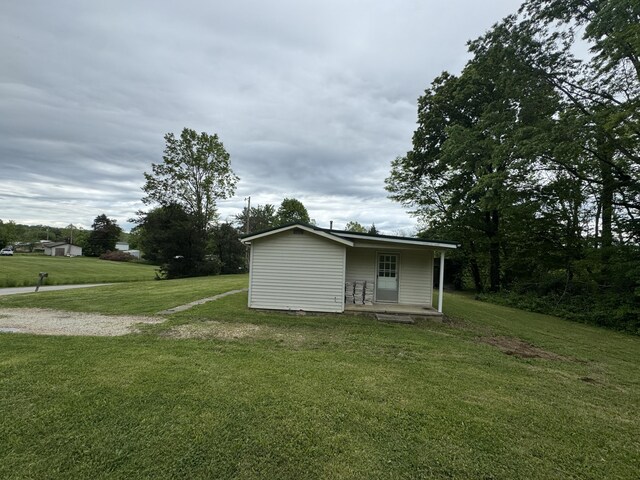 357 Powell Rd, Clay City, KY 40312 - rear view of house with a yard