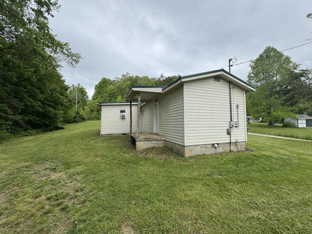 357 Powell Rd, Clay City, KY 40312 - view of property exterior featuring a lawn and crawl space