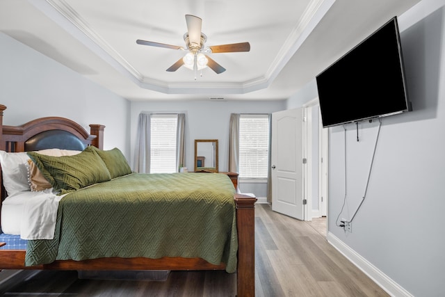 157 Cross Park Dr, Georgetown, KY 40324 - bedroom with a tray ceiling, ornamental molding, light wood-type flooring, baseboards, and a ceiling fan