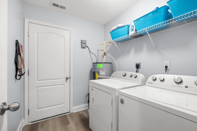 157 Cross Park Dr, Georgetown, KY 40324 - clothes washing area with water heater, separate washer and dryer, dark wood finished floors, and baseboards