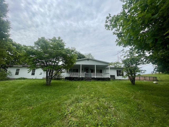 1038 Levy Rd, Paris, KY 40361 - rear view of house featuring a lawn and covered porch