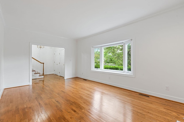 303 Patchen Dr, Lexington, KY 40517 - spare room featuring stairway, light wood-type flooring, baseboards, and crown molding