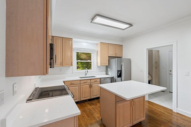 303 Patchen Dr, Lexington, KY 40517 - kitchen with appliances with stainless steel finishes, a sink, a center island, dark wood finished floors, and ornamental molding