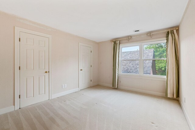 303 Patchen Dr, Lexington, KY 40517 - unfurnished bedroom with light carpet and baseboards