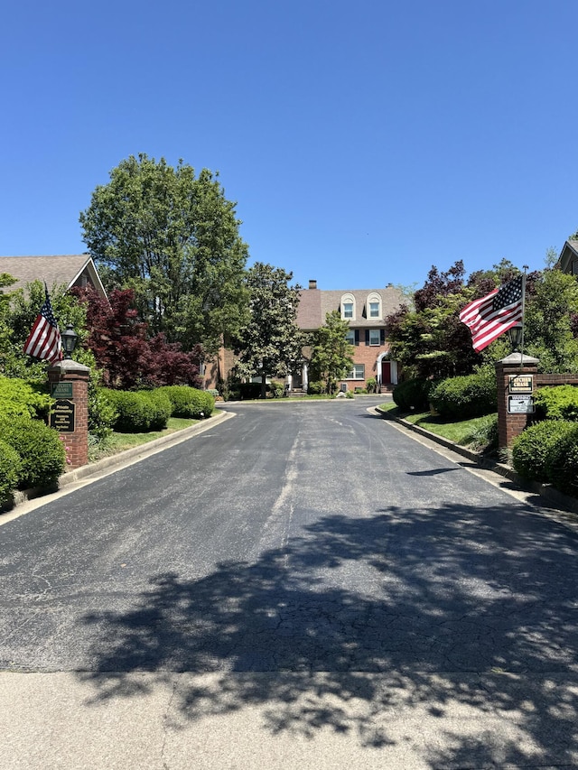 303 Patchen Dr, Lexington, KY 40517 - view of asphalt road featuring curbs