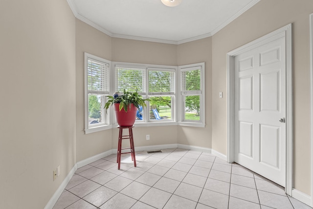 entryway with plenty of natural light, ornamental molding, light tile patterned floors, and baseboards