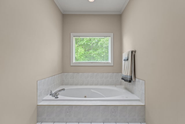 bathroom with a tub with jets and ornamental molding