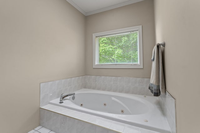 bathroom with a jetted tub and crown molding