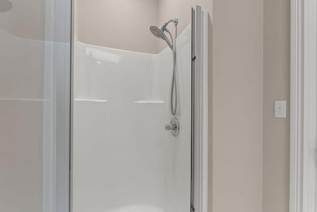 bathroom with a shower stall