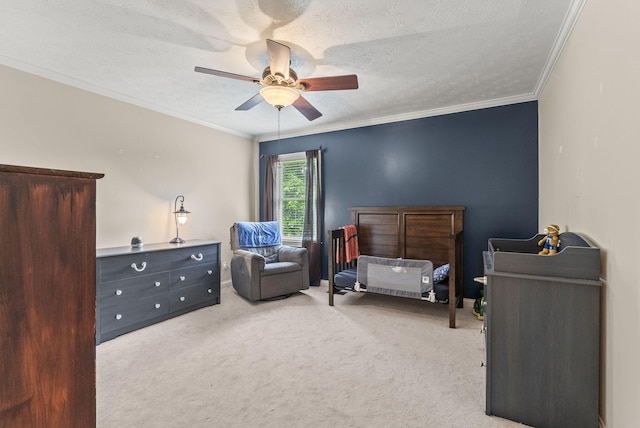 carpeted bedroom with crown molding, a ceiling fan, and a textured ceiling