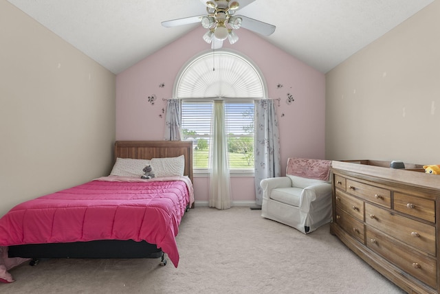 bedroom featuring vaulted ceiling, light carpet, ceiling fan, and baseboards
