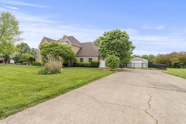 view of property hidden behind natural elements with a detached garage and an outbuilding