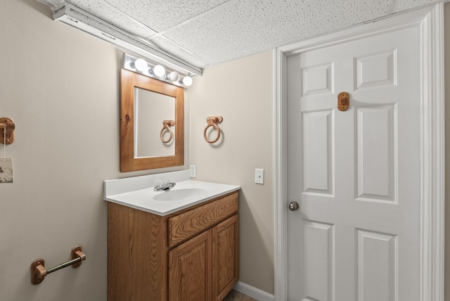 bathroom featuring vanity and a paneled ceiling