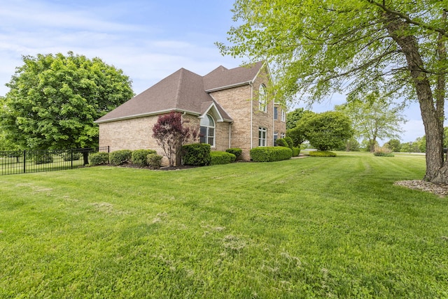 view of side of property featuring brick siding and roof with shingles