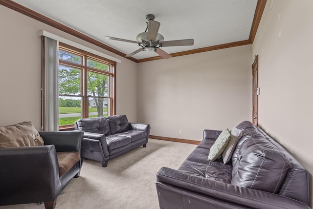 living room featuring ornamental molding, carpet flooring, ceiling fan, and baseboards