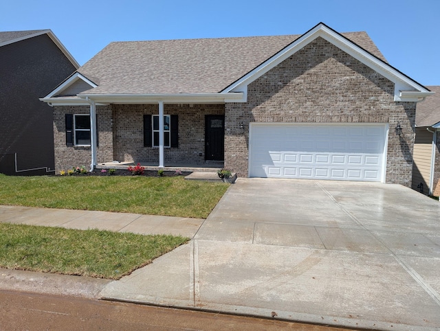 view of front of home with an attached garage, driveway, a front lawn, a porch, and brick siding
