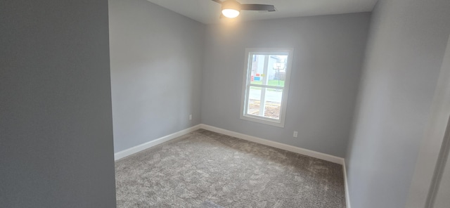 spare room featuring carpet flooring, a ceiling fan, and baseboards