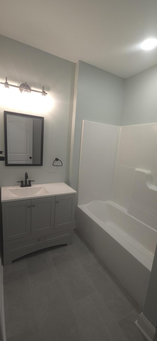 bathroom with tile patterned floors and vanity
