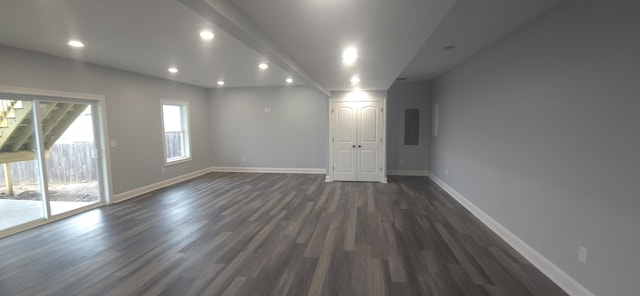 unfurnished room featuring dark wood-style floors, baseboards, and recessed lighting