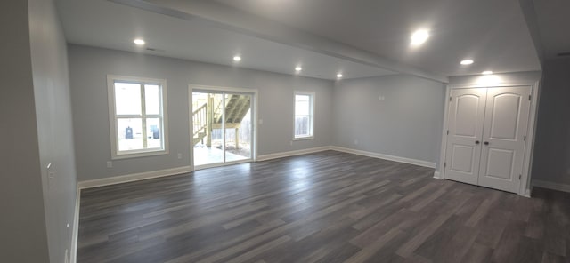 unfurnished room with dark wood finished floors, baseboards, and recessed lighting
