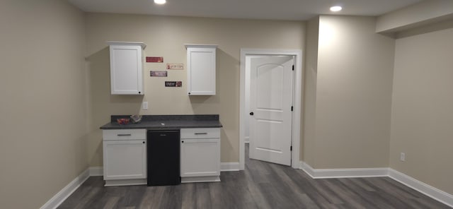 kitchen with dark wood finished floors, white cabinetry, recessed lighting, dark countertops, and baseboards