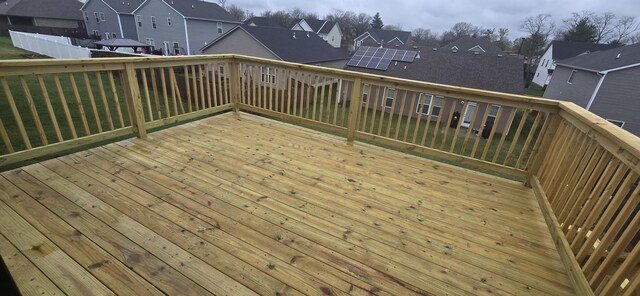 wooden deck with a residential view