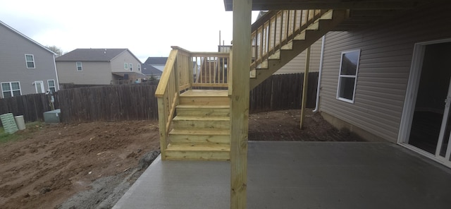 view of patio / terrace featuring stairs and fence