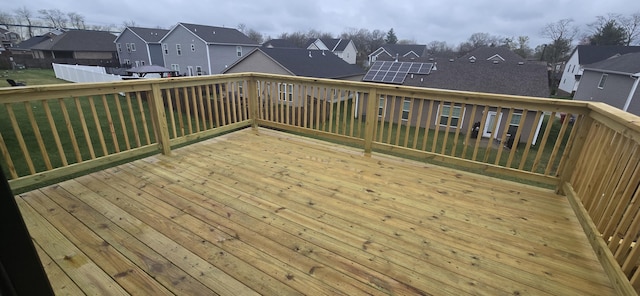 wooden deck with a residential view