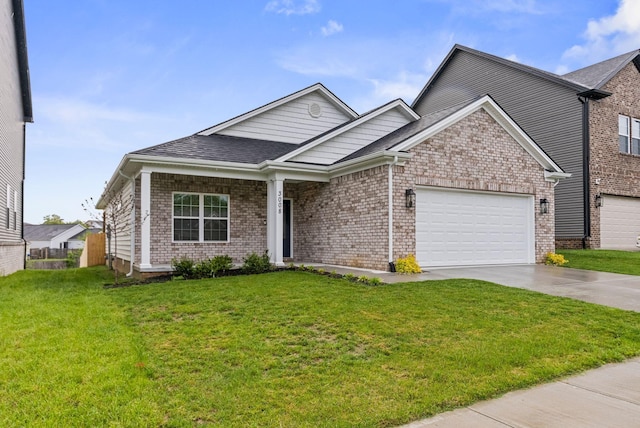 3008 Locust Blossom Cv, Lexington, KY 40511 - view of front of property featuring concrete driveway, a garage, a front yard, and brick siding