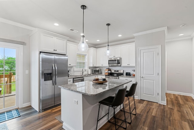 3008 Locust Blossom Cv, Lexington, KY 40511 - kitchen featuring appliances with stainless steel finishes, baseboards, white cabinets, ornamental molding, and recessed lighting