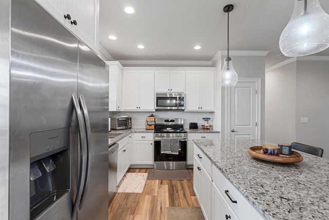 3008 Locust Blossom Cv, Lexington, KY 40511 - kitchen with appliances with stainless steel finishes, crown molding, light wood-style flooring, white cabinetry, and recessed lighting