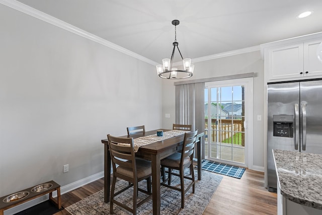 3008 Locust Blossom Cv, Lexington, KY 40511 - dining room with baseboards, crown molding, a chandelier, wood finished floors, and recessed lighting