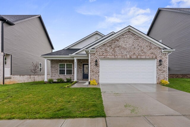 3008 Locust Blossom Cv, Lexington, KY 40511 - craftsman-style house with an attached garage, driveway, a front yard, and brick siding