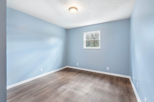 1517 Steadmantown Ln, Frankfort, KY 40601 - unfurnished room with dark wood-style flooring, baseboards, and a textured ceiling
