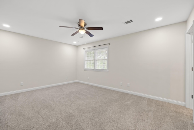carpeted empty room with ceiling fan, baseboards, and recessed lighting