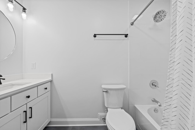 bathroom with vanity, toilet, shower / bathtub combination, and baseboards