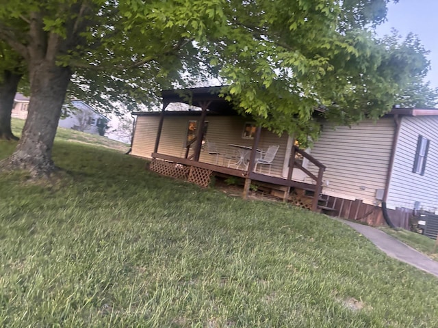 7410 Bald Knob Rd, Frankfort, KY 40601 - rear view of house with a yard, a wooden deck, and central AC