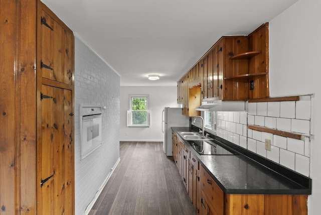 834 Boyd Ave, Danville, KY 40422 - kitchen with white appliances, a sink, dark wood-type flooring, brown cabinetry, and dark countertops